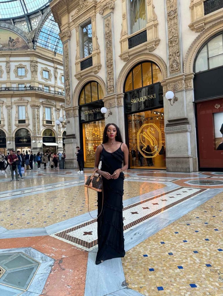 a picture of me wearing a long black dress inside the Galleria in Milan