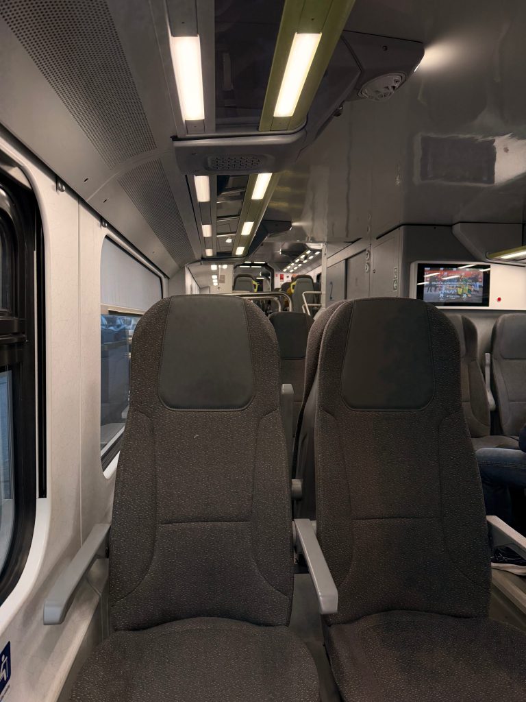 A PICTURE OF SEATS IN A TRAIN
