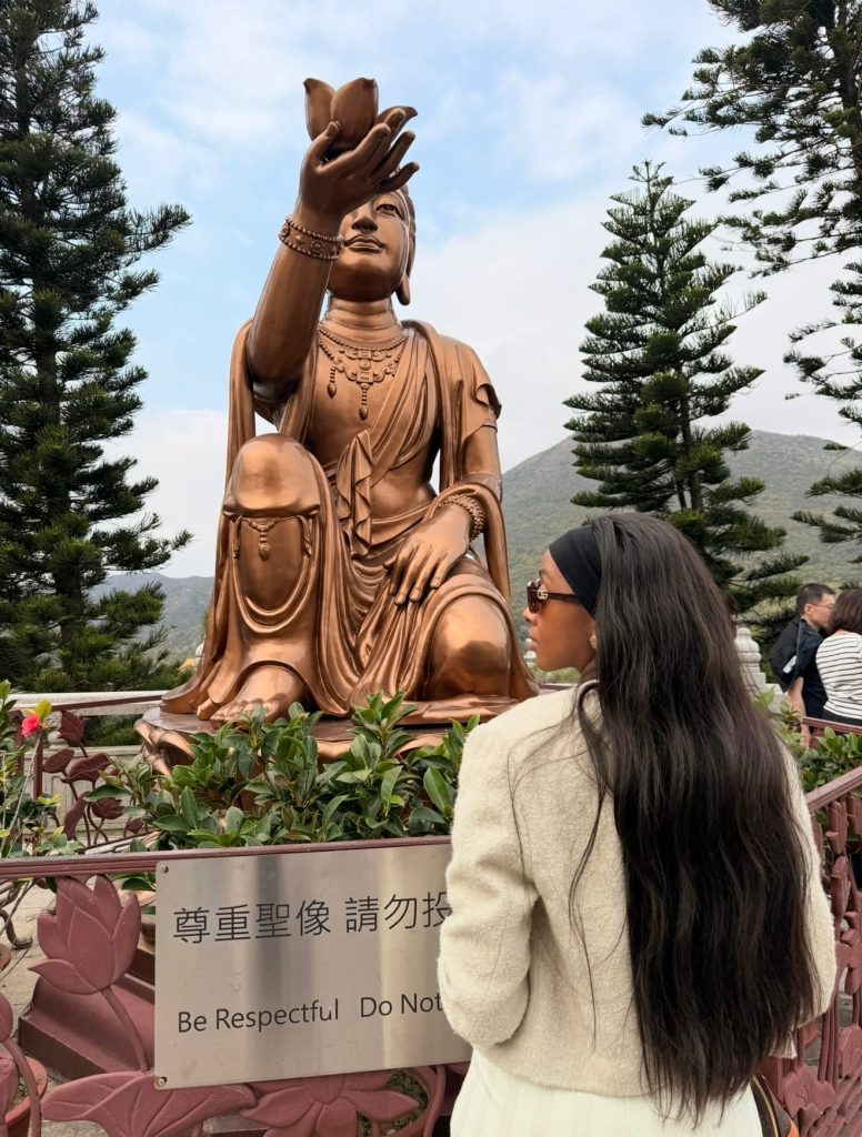 Buddha statue and me infant of it